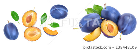 fresh blue plum and half with leaves isolated on white background. Top view. Flat lay fresh blue plum and half with leaves isolated on white background. Top view. Flat lay 139448109