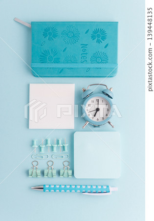 Blue School Stationery Flat Lay with Alarm Clock Blue School Stationery Flat Lay with Alarm Clock 139448135