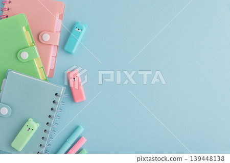 Pastel school supplies flat lay on light blue background Pastel school supplies flat lay on light blue background 139448138