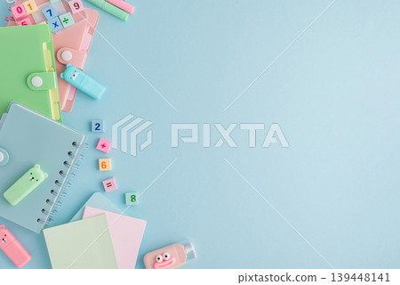 Pastel school supplies flat lay on light blue background Pastel school supplies flat lay on light blue background 139448141