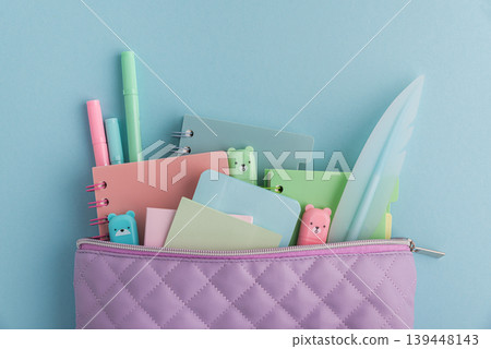 Pastel school supplies filling a quilted pencil case Pastel school supplies filling a quilted pencil case 139448143