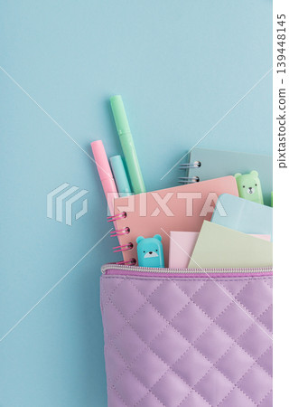 Pastel school supplies filling a quilted pencil case Pastel school supplies filling a quilted pencil case 139448145