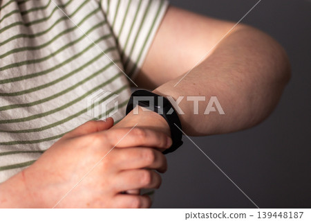 Health tracker on woman hand. Focus on calm health tracking. Balance between digital anxiety and calm life living. Data as background whisper 139448187