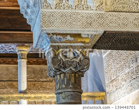 Ornate Moorish Column Capital With Arabesque Carvings and Gilded Architectural Details, Alhambra, Granada Ornate Moorish Column Capital With Arabesque Carvings and Gilded Architectural Details, Alhambra, Granada 139448701
