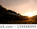 The SL Banetsu Monogatari train runs bathed in the setting sun. 139448999