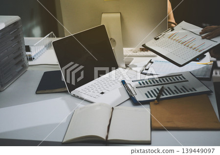 Accounting company provide finance and taxation planning for profitable cash flow, Auditor accountant working in office, analyze financial data and accounting record with calculator Accounting company provide finance and taxation planning for profitable cash flow, Auditor accountant working in office, analyze financial data and accounting record with calculator 139449097