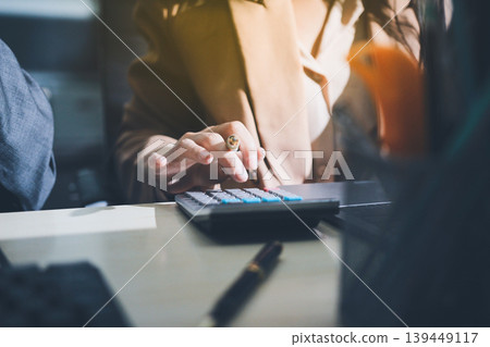 Accounting company provide finance and taxation planning for profitable cash flow, Auditor accountant working in office, analyze financial data and accounting record with calculator 139449117