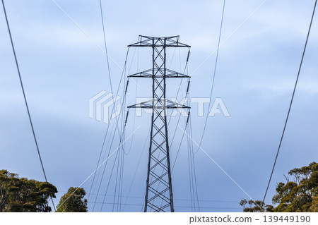 The top section of a large and high electrical transmission tower The top section of a large and high electrical transmission tower 139449190