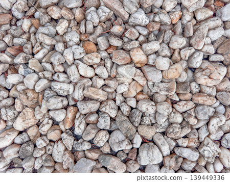 White natural pebbles texture with rounded sea stones and neutral colors, rocky surface background for construction, landscaping, garden decoration and exterior materials. White natural pebbles texture with rounded sea stones and neutral colors, rocky surface background for construction, landscaping, garden decoration and exterior materials. 139449336