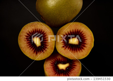 A close-up, overhead view of a ruby red kiwi. A close-up, overhead view of a ruby red kiwi. 139451530
