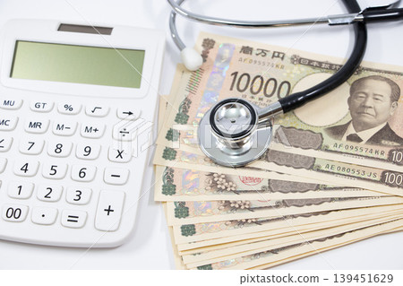 Stethoscope, calculator, money Stethoscope, calculator, money 139451629
