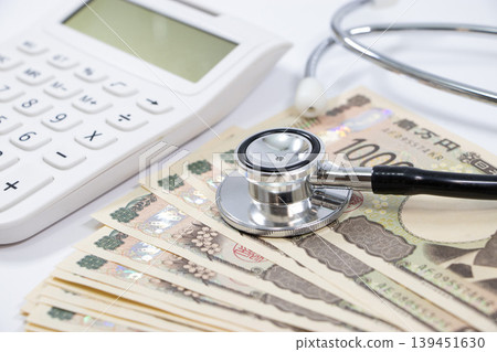 Stethoscope, calculator, money Stethoscope, calculator, money 139451630