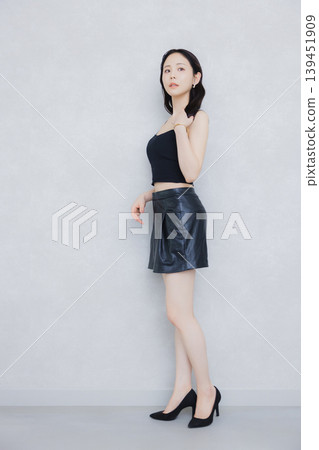 Female model in a studio photoshoot Female model in a studio photoshoot 139451909
