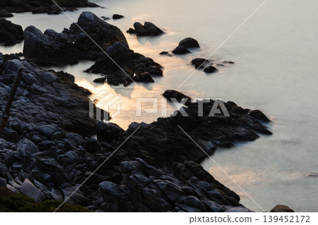 The sunset over Yakushima, where gods reside, shimmering in the waves (winter) 139452172