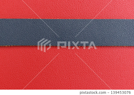 shiny red leather background with dark blue strap shiny red leather background with dark blue strap 139453076