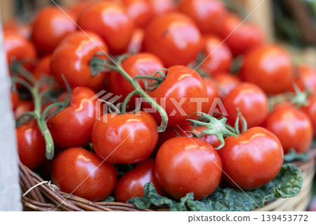 Fresh red tomatoes displayed on store counter for sale Fresh red tomatoes displayed on store counter for sale 139453772
