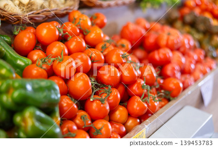 Eco products store counter with large assortment of tomatoes for salent Eco products store counter with large assortment of tomatoes for salent 139453783