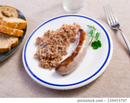 Fried pork or chicken homemade sausage and porridge buckwheat Fried pork or chicken homemade sausage and porridge buckwheat 139453797