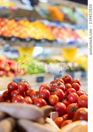 Eco products store counter with large assortment of tomatoes for salent Eco products store counter with large assortment of tomatoes for salent 139453820