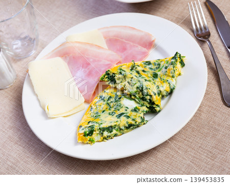 Two slices of omelet, bacon and cheese Two slices of omelet, bacon and cheese 139453835
