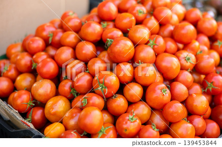 Fresh red tomatoes displayed on store counter for sale 139453844