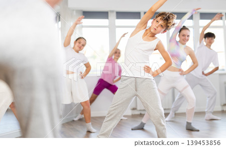 Group of children warming up before dance class Group of children warming up before dance class 139453856