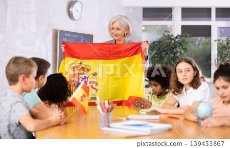 students listen to woman teacher who talks about Spain 139453867