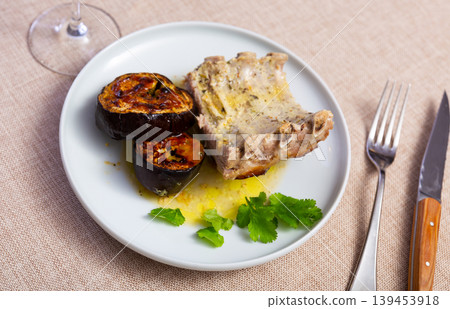 Delicious pork ribs with stewed eggplant on plate Delicious pork ribs with stewed eggplant on plate 139453918