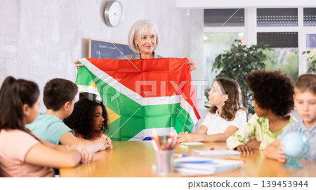 students listen to woman teacher who talks about South Africa students listen to woman teacher who talks about South Africa 139453944