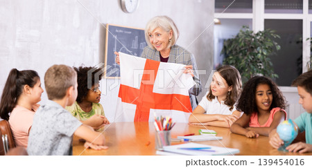 Qualified woman teacher tells pupils the history of England Qualified woman teacher tells pupils the history of England 139454016