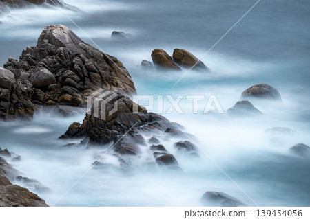 The sunset over Yakushima, where gods reside, shimmering in the waves (winter) 139454056