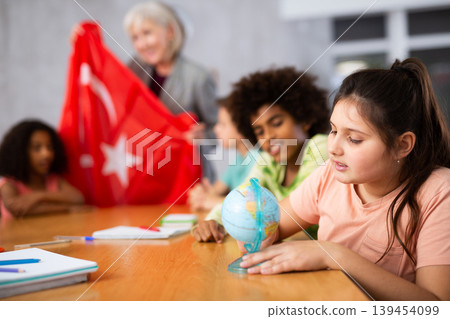 students listen to woman teacher who talks about Turkey students listen to woman teacher who talks about Turkey 139454099