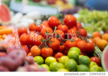 Eco products store counter with large assortment of tomatoes for salent 139454210