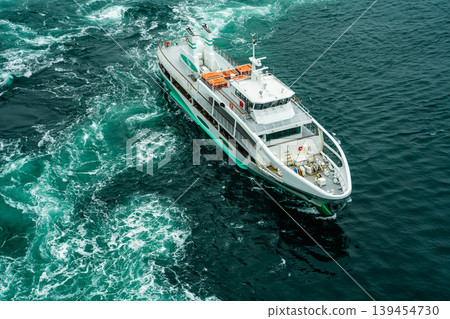 Naruto Bridge Promenade: Whirlpools (spring tide) and sightseeing boats from the Uzunomichi (Whirlpool Walkway) [Naruto City, Tokushima Prefecture] 139454730