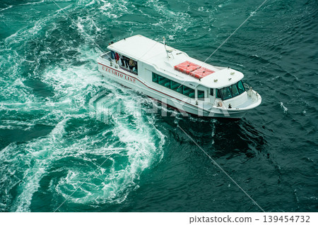 Naruto Bridge Promenade: Whirlpools (spring tide) and sightseeing boats from the Uzunomichi (Whirlpool Walkway) [Naruto City, Tokushima Prefecture] 139454732