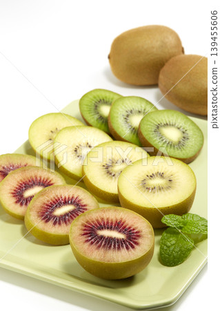 An image of three fresh kiwis placed against a white background. An image of three fresh kiwis placed against a white background. 139455606