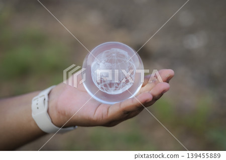 Renewable energy concept Earth Day or environment protection Hands protect forests that grow on the ground and help save the world. Renewable energy concept Earth Day or environment protection Hands protect forests that grow on the ground and help save the world. 139455889