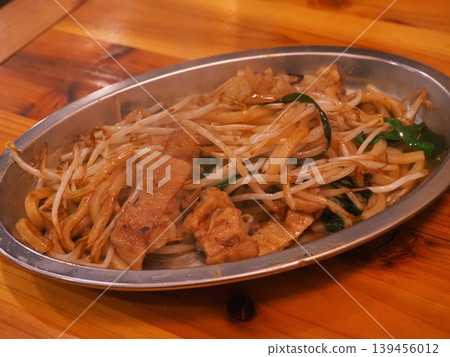A staple dish at izakayas: Stir-fried udon noodles with pork and plenty of bean sprouts. A staple dish at izakayas: Stir-fried udon noodles with pork and plenty of bean sprouts. 139456012