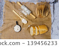 Baking ingredients with rolling pin, flour, and sliced bread 139456233