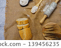Baking ingredients with rolling pin, flour, and sliced bread 139456235