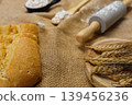 Baking ingredients with rolling pin, flour, and sliced bread 139456236