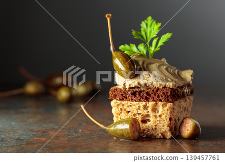 Bread with pate, capers, and fresh parsley. Bread with pate, capers, and fresh parsley. 139457761