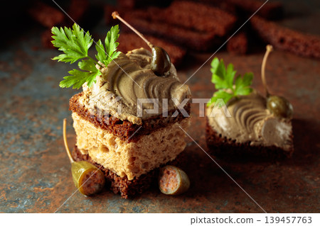 Bread with pate, capers, and fresh parsley. Bread with pate, capers, and fresh parsley. 139457763