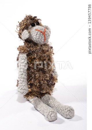 Crocheted sheep toy on a white background Crocheted sheep toy on a white background 139457786