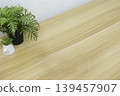 Minimalist wooden desk background with indoor plants for product placement. 139457907