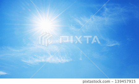 Bright sun shines overhead, casting radiant beams 139457915