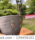 Tea bowl with a heron pattern depicting an outdoor tea ceremony scene 139458101