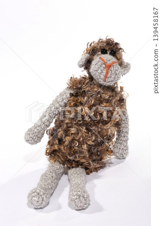 Crocheted sheep toy on a white background Crocheted sheep toy on a white background 139458167