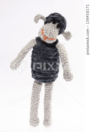 Crocheted sheep toy on a white background Crocheted sheep toy on a white background 139458171