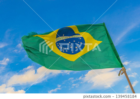 Brazilian flag with blue sky background Rio de Janeiro Brazil. Brazilian flag with blue sky background Rio de Janeiro Brazil. 139458184
